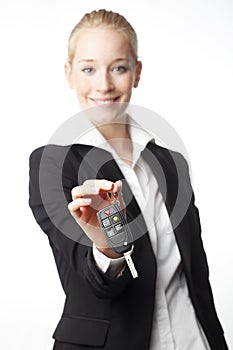 Young woman giving car key