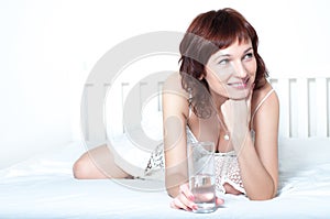 Young Woman with glass of fresh Water