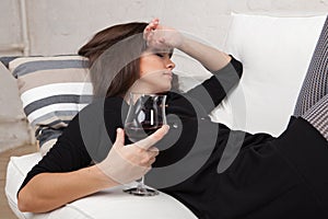 Young woman with a glass of red wine