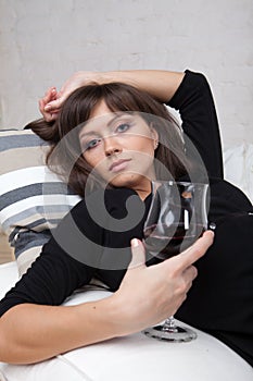 Young woman with a glass of red wine