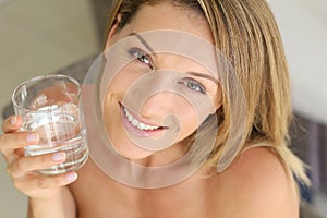 Young woman with a glass of water