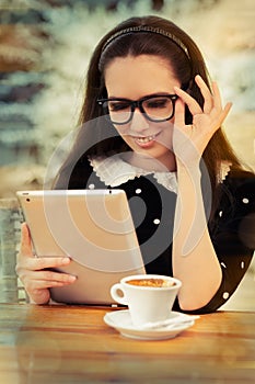 Young Woman with Glasses and Tablet Having Coffee