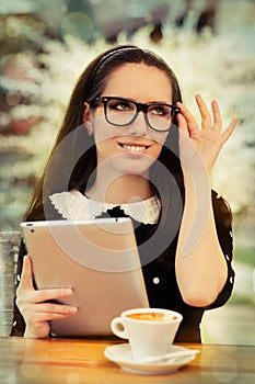 Young Woman with Glasses and Tablet Having Coffee