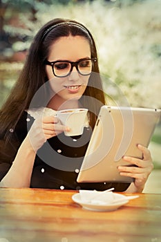 Young Woman with Glasses and Tablet Having Coffee