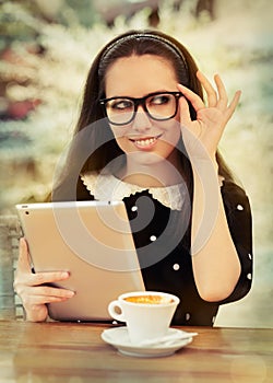 Young Woman with Glasses and Tablet Having Coffee