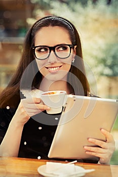 Young Woman with Glasses and Tablet Having Coffee