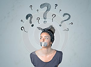Young woman with glued mouth and question mark symbols