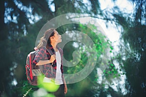 Young woman go adventure hiking on her vacation.