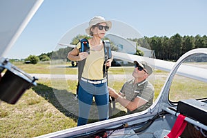 young woman going on board glider