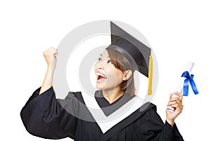 young woman graduating holding diploma and looking