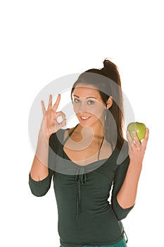 Young woman with granny smith apple