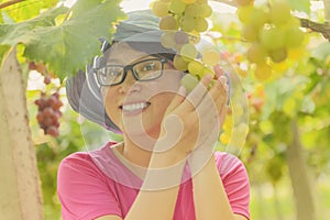 Young woman in grape plantation