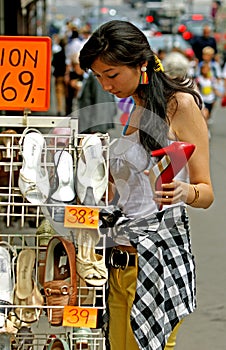 Young woman with great joy when buying shoes