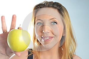 Young woman with green apple