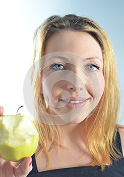 Young woman with green apple