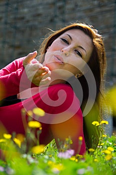 Young woman on green field