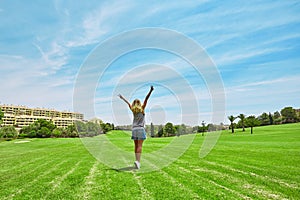 Young woman in green meadow