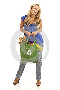 Young woman with green recycled grocery bag