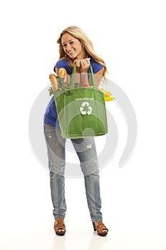 Young woman with green recycled grocery bag