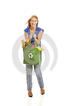 Young woman with green recycled grocery bag