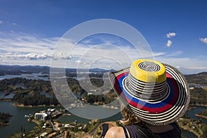 Young woman at Guatape lake in Antioquia, Colombia