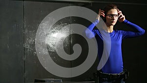 Young woman with the gun on an indoor shooting range. preparation for shooting