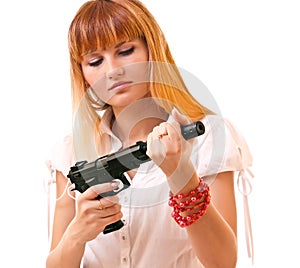 Young woman with gun isolated