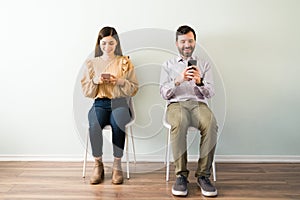 Young woman and guy using a dating service app
