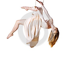 Young woman gymnast on rope-ladder