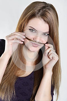 Young woman with hair moustaches