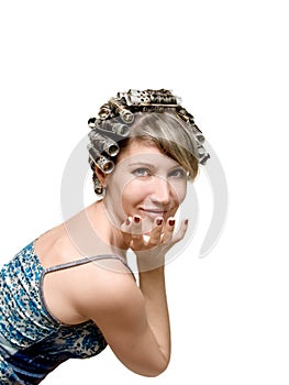 Young woman with haircurlers in her heir photo