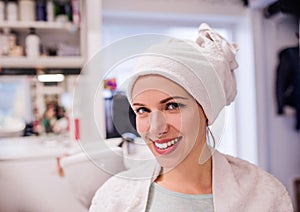 Young woman at hairdresser salon having her hair done.