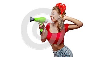 Young woman with hairdryer photo