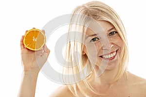 Young woman with halves of oranges, close-up