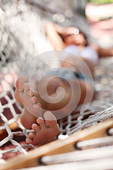 Young woman in hammock.