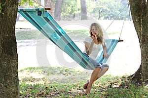 Young woman in a hammock