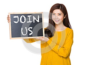 Young woman hand hold with the blackboard showing phrase of join