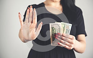 Young woman hand stop sign in money