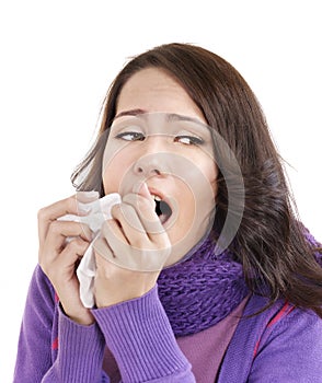 Young woman with handkerchief having cold.