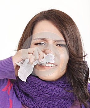 Young woman with handkerchief having cold.