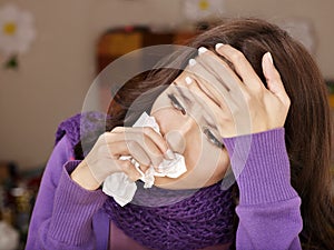 Young woman with handkerchief having cold.