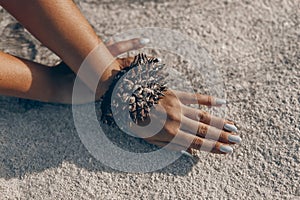 young woman hands close up with handcraft bracelet made of durian peel