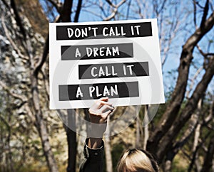 Young Woman Hands Holding Blank Paper with Life Motivation Phrase