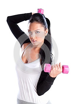 Young woman hang up hands weights