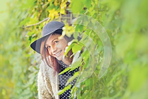 Young woman happy in colorful forest foliage.