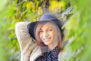 Young woman happy in colorful forest foliage.