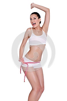 Young woman happy with her waist measure