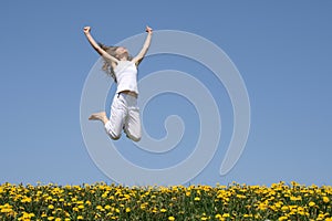 Young woman in a happy jump photo