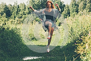 Young Woman happy jumping up summer