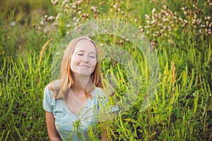 Young woman happy because no longer feels allergic to ragweed